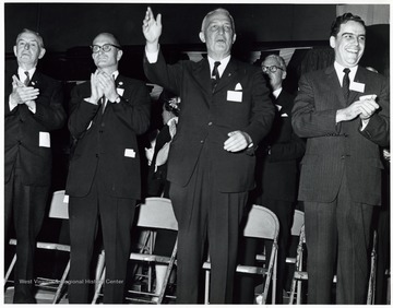'Left to Right - Unknown, Senator John D. Hoblitzell, Jr., Senator Chapman Revercomb, Governor Cecil Underwood' at President Eisenhower's speech at the Kanawha Airport.