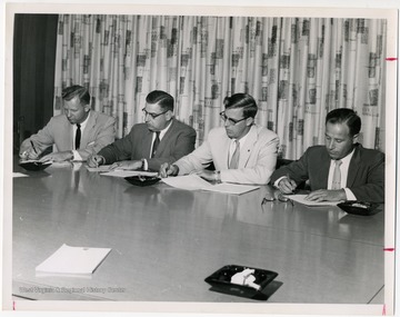 Left to right, Benjamin W. Skeen, secretary-treasurer of the State Federation; Eugene A. Carter, unidentified, unidentified.