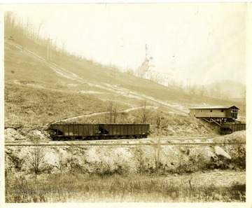 A view of Atlas Coal corporation with filled cars on the rail.