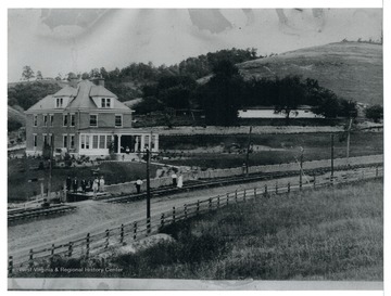 A view of the J. B. Supler Farmhouse located on State Route 58, it would become the Pieter Poth Holland Dairy Farm.