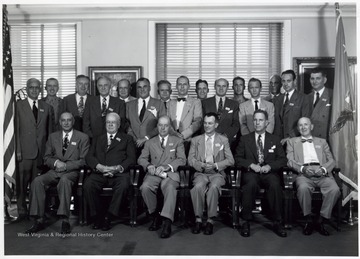 'Escorts: Lt. Colonel C. H. Davidson, USAF, Lt. Colonel Roy L. Kline, USMC; Sitting, Left to Right: Carnot R. Allen, Robert Byron, William R. Daley, Don Dunham, Ray C. Ellie, Melville F. Ferguson; Standing, Left to Right: Norman W. Foy, Lt. Colonel Kline, R. C. Simmons, Carl B. Fritsche, C. E. Smith, Henry G. Hotchkiss, Walter Trohan, Vance Johnson, D. C. Turnbull, Jr., G. S. Moore, Lt. Colonel Davidson, John Ed Pearce, DeWitt Wallace, J. Lacey Reynolds, R. G. Rydin'