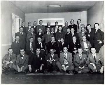'Legal light was not missing at the Tygarts Valley County Club recently when members of the Randolph County Bar association held their annual dinner. Guests included members of the Tucker and Upsher County bars. Pictured in the photograph  by Frank Palavido are: First Row - W. W. Barron, Joseph J. Berzito, L. Baker Fowler, A. E. Fiorentino, Bonn Brown all of Elkins; Dean Heironimus, Davis; James H. Coleman, Buckhannon. Second Row - Wayne K. Pritt, Parsons; D. E. Cuppett, Sr., Thomas; former Governor H. G. Kump, Judge A. Jerome Dailey, D. H. Hill Arnold, E. A. Bowers, William Howard, Elkins. Third Row - William P. O'Brien and N. S. Young, Buckhannon; William M. Harmon, Parsons; Ralph See, Elkins; Kelcel M. Ross, Buckhannon; Stanley Bosworth, Henry Higginbotham, F. E. Tallman, Donald K. Crawford, John S. Caplinger and John B. Chenoweth, Elkins. Fourth Row - Jacob S. Heyer, Keith Cunningham and Holt Woddell, Elkins; Dow Jennings, Buckhannon; John Cain, Elkins; Thomas L. Stockert, Lycurgus Hyre and Myron B. Hymes, Buckhannon; Cyrus S. Kump, Elkins.'