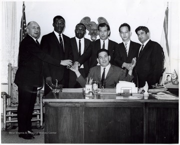 A photograph of A. James Manchin (seated) with an unidentified group of gentlemen.
