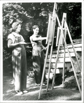 Grace Martin Taylor (left) along with an female painter paint outdoor.