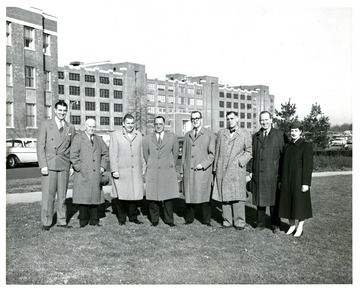 Left to Right:  Mr. PhCol [sic], Sales Manager, Lederle; Mr Troxwell, Fairmont, Vice President, West Virginia State Association of Pharmacy (WVSAP); William Dixon, Oak Hill, Secretary WVSAP; State Senator and Member of the State Board of Pharmacy; Mr. Ralston, Weston; J. Ray Fredlock, Morgantown, President WVSAP, 1955-56; Mr. H. R. Ridenour, 2nd or 3rd Vice President of WVSAP; and unidentified woman guide.
