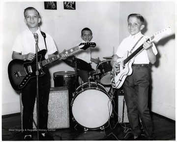 A photograph of three young boys, the Blosser youngsters, as a musical group.  They organized a Cancer Crusade.