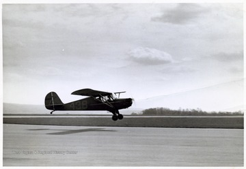A photograph of a military plane either taking off or landing.