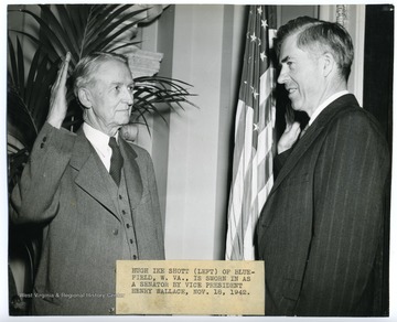 'Hugh Ike Shott (left) of Bluefield, W. Va., is sworn in as a senator by Vice President Henry Wallace.'