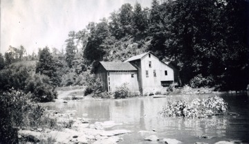 'Noted old Anderson mill at Falls Mills or Falls of Little Kanawha. The mill was operated by water wheel, the water following from top of falls, on north or road side of river. For many years people first found way into this Bulltown section for salt at Haymonds Salt Works and later, when this mill built about 2 miles up, carried wool here to be carded and which was woven into cloth. One trail led from Weston and Gauley Pike, up Knawls Creek, over "pigeon roost" and down.'