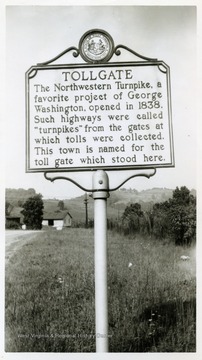 "Tollgate--The Northwestern Turnpike, a favorite project of George Washington, opened in 1838.  Such highways were called "turnpikes" from the gates at which tolls were collected.  This town is named for the toll gate which stood here."