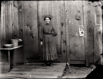 A portrait of woman taken outside of the back door in Helvetia, W. Va.