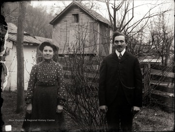 A portrait of a couple taken outside of the house in Helvetia, W. Va.