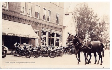 State police motor cycles parked in front of the Folk's Variety Store on Rt. 50.  The store is located near a bridge over the Simpson Creek; the building still remains in 2008.