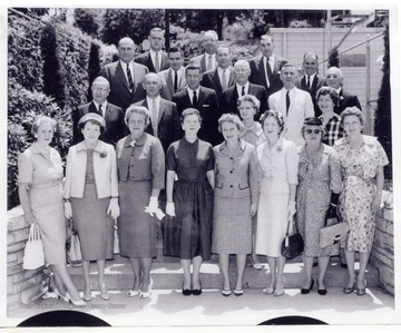 The trustees of the Benedum Foundation at Benedum Civic Center: front row from left to right 1) Mrs. R. L. Cutlip, 4) Mrs. Byron Randolph, 8) Mrs. Margaret Merrells; second row 1) David Johnson 4) Mrs. Ross Linger third row 4) R. L. Cutlip; fourth row 2) Rev. Ross Linger 3) Byron Randolph.
