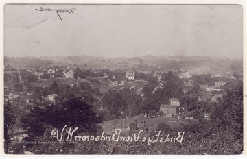 The photo is taken from a hill behind Ace Hardware Store on Rt. 50, looking toward North East; B&O Railroad tracks in Simpson Creek & Water St. are at lower left  corner; the Darndum & Baily sign is at the lower bottom corner; the photo is turned correctly although the words are in reversed.                                         