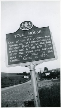 'One of the six original toll houses on the Cumberland or National Road is on the hill a mile and a half SW. Built after the road was turned over to the State by the United States in 1835.'