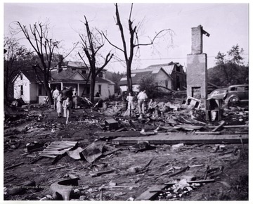 A view of Mount Clare after the tornado, people examine the site completely destroyed.