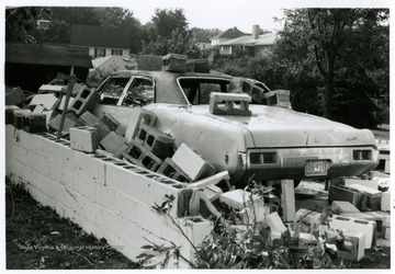 Shown here is a damage done on Betty Wyatt's car and garage by the tornado of August, 1970 in Bridgeport.  The photo was taken pointing to Virginia Avenue.