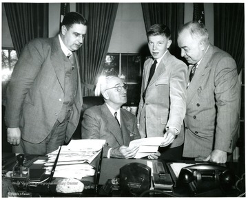 From left to right: Eugene A. Carter, President Truman, Unknown and Senator Sam Ervin.