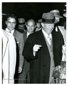 From left to right: governor Cecil Underwood, Senator John D. Hoblitzell, Jr., President Dwight Eisenhower.  President Eisenhower speaks at Kanawha Airport, Charleston, W. Va.