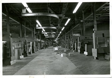 A view of middle floor, Cutting Room at Adamston Flat Windown Glass.  Looking toward east section of the building.  This floor houses from stall #30 to #40; the boss cutter's office is located far right near the elevator.