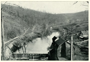 'A picturesque view on Decker's Creek in the rear of the Public School Building, showing a section of the Morgantown &amp; Kingwood Railroad.'  This photo is from a booklet, 'West Virginia University and its Picturesque Surroundings,' 1901.