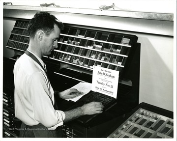 A male working with Typography machine.