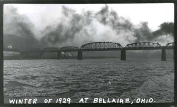 A view of a truss bridge over the Ohio River at Bellaire, Oh; taken in Winter of 1929.