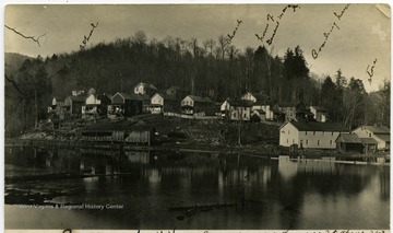 'Good photo of houses. Ladwig identified many. Taken from river. (I understand there were no bars in Evenwood, something unique for a lumber town'.