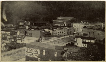 This is an excellent photo of main street showing buildings with advertising signs. 