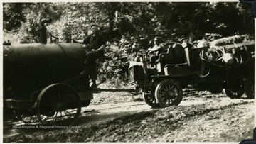 '45 horse power first boiler being hauled from Clifton Run, W. Va. across the mountain to Kerens and into Montes, W. Va., across the mountain to the bandmill set on Clover Run where the boiler was used as one of the units for making steam in the bandmill. For this haul of boiler 4 horses were on the front and FWD truck pushed with a push pole.'.