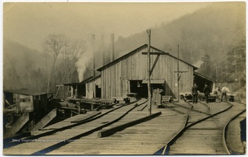 Railroad tracks lead in and out of the mill for transportation of lumber.