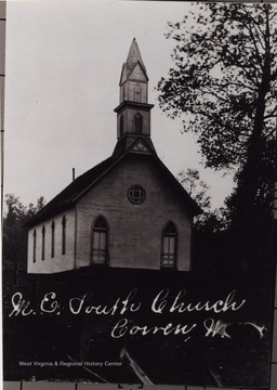 The Church is located "where road leads to town park."