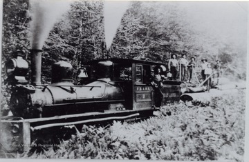 Crew is posed behind the locomotive.
