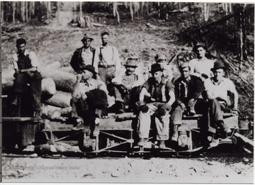 Portrait thought to be "at twenty mile, Nicholas County. The fifth over hands crossed, mustache, Neil Romano, the fifth over back row with white shirt and hat Augostino Romano."