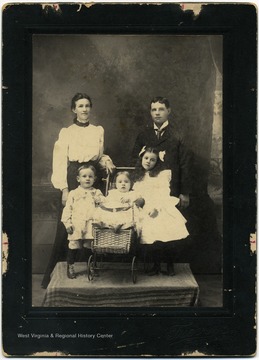 From "Beckley U.S.A." by Harlow Warren, p. 386, vol. 2. In book: " The E.E. Tucker family, Mrs. (Nannie Lemon), 'Ed' and children: Adair, Verne and Rio" (p. 386). On back of portrait: "Left to right: Nana Lemon (Tucker), Edgar Edwin Tucker, Adair, Verne and Rio-children."