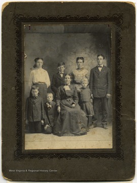 From "Beckley U.S.A." by Harlow Warren, p. 406, vol. 2. Attached to portrait: "Back row: Mary Prince (Smith); Alfred Prince; Ada Prince (Fitzpatrick); John Prince. Front row: Fred, Okey, Mrs. Dave Prince, Ella Prince."