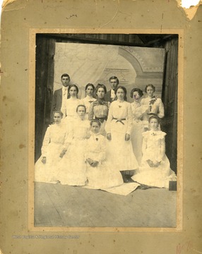 From "Beckley U.S.A." by Harlow Warren, p. 367, vol. 2. In book: "In this picture the bride and groom were long gone; 'French leave' as they might have said it. Back row: Claud Prince, Maud Prince (Scott), Lake Prince (Counts), Lena Prince (Hicks), Charley Prince, Lottie Deck (Clyde Shumate), Zeta Williams (Walker), Bess Kent (Charley Prince). Front row: Bertie Prince (Griffith), Ada Prince (Fitzpatrick), Motie Deck (Prince), Lyde Deck (Adney C. Sutphin)(p. 367).