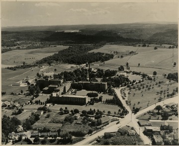From "Beckley U.S.A." by Harlow Warren, p. 101, vol. 1. In book: "Pinecrest Sanitarium, 1955, with Raleigh County Memorial Airport in the distance. George W. Ballard, Business Manager" (p. 101).Harlow Warren, copyright 1955. See record 036460. 
