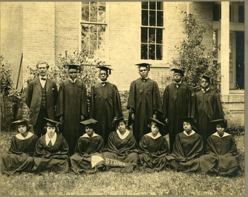 Group shot of the 1920 graduates in caps and gowns. First Row: Pres. McDonald, Harris, Clark, Lee, Walker, Redman. Second Row: Parker, Freeman, Airington, Snowden, Harmon, Scott, Wildy.