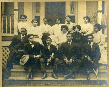 Group photo of Storer College class of 1909 sitting on front steps of building on Storer College campus.