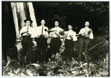 "Gimmel and Marti boys enjoy a Sunday beer." Left to right: Ernest Gimmel, Simon Gimmel, Leonard Marti, John Gimmel, Gottfried Gimmel.