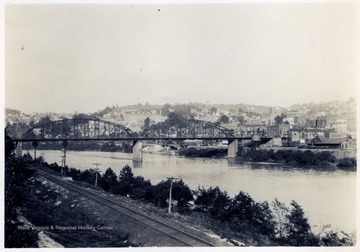 Looking N.E. of Monongahela River Bridge connecting B.&amp;O. and M.R. Depots - Also West Virginia University Buildings