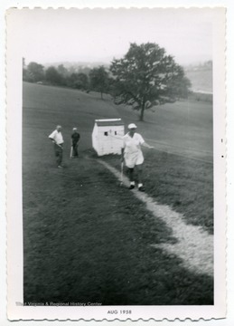 R. C. Spangler playing golf.
