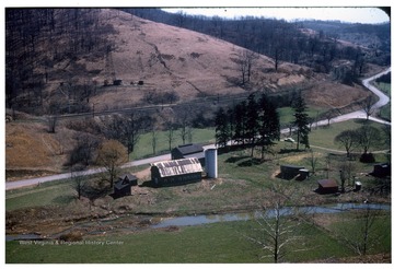 Milking area of Dairy farm. Twin Houses out of picture on right. Two lane Route 50 passes in front of property.