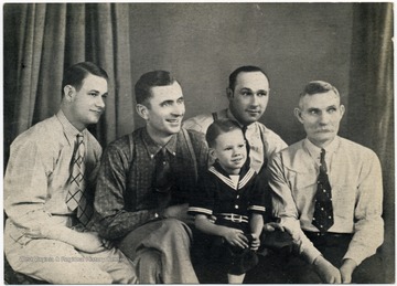 Left to right: "Just Plain John" Oldham; Cowboy Loye Pack; possibly Lew Childre; Unidentified child; James "Sheepherder" Moore.  Performed at WWVA Wheeling or WMMN Fairmont.