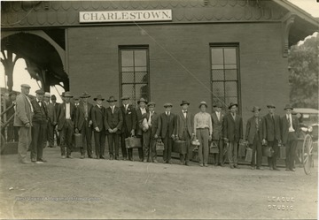 A line of men, probably recruits, outside the Charles Town, W. Va. train station.