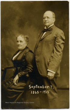Photograph post card of West Virginia Governor (1890-1893), A. B. Fleming and his wife, Carrie. There is an unaddressed Thank You note on the back.