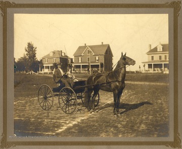 William B. Packette Sr.and possibly his daughter Frances Packette in a buggy harnessed to a horse named "Prince".