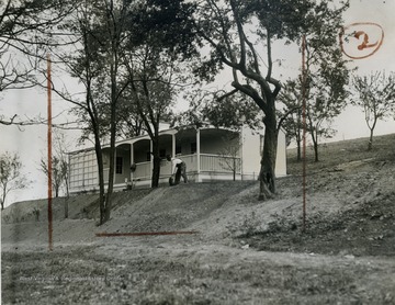 The ground around each Arthurdale home was landscaped as much as possible. Honeysuckles, transplanted from nearby mountain slopes, were in bloom and lawns were being sown.